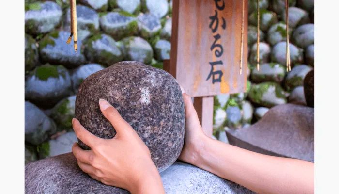Omokaru Stone in Fushimi Inari Taisha.