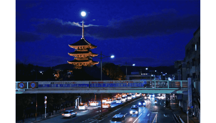 Toji Temple five-story pagoda with full moon in Kyoto.